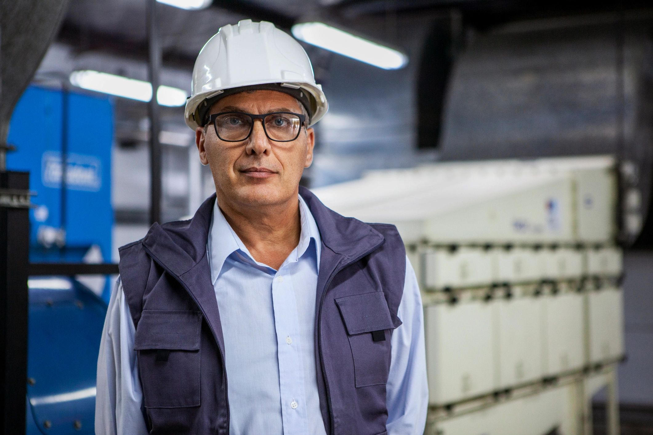 Inspection supervisor standing inside an industrial facility